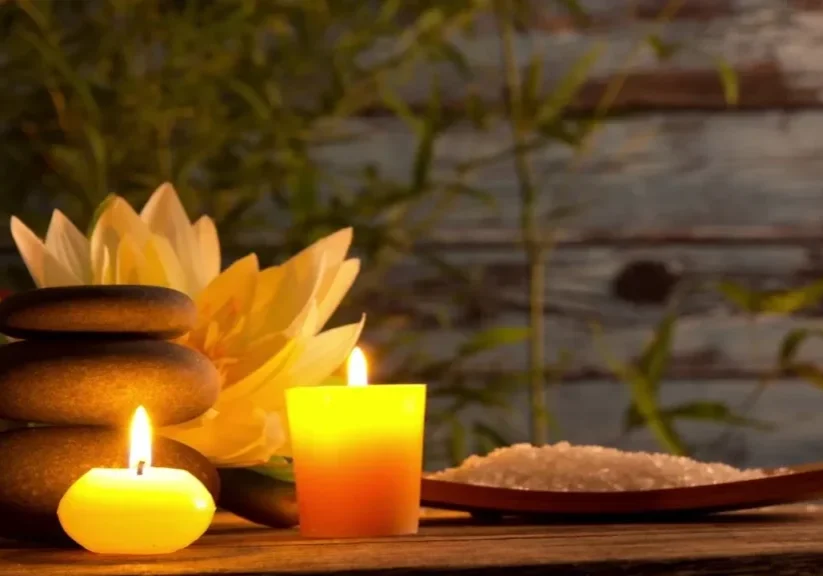 Candles and stones with lotus flower.